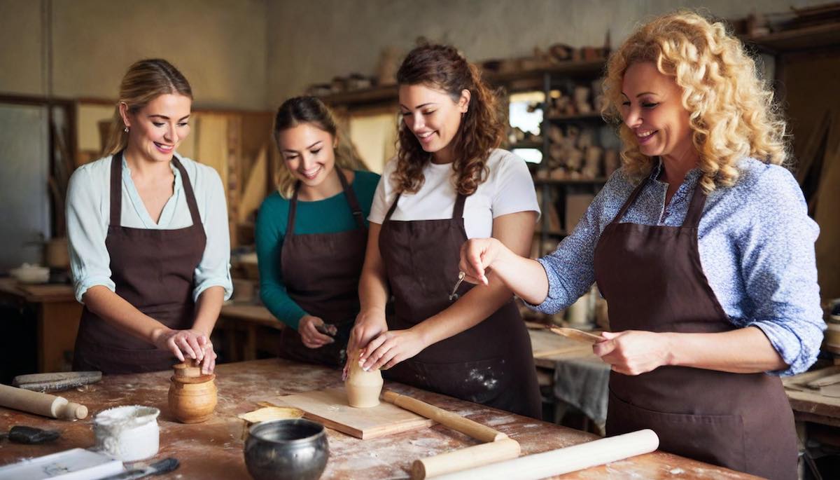 Women particapating in a pottery workshop